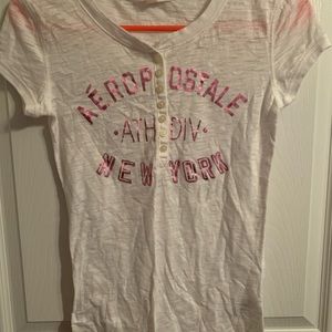 Aeropostale short sleeve shirt.  White with pink lettering. Small.